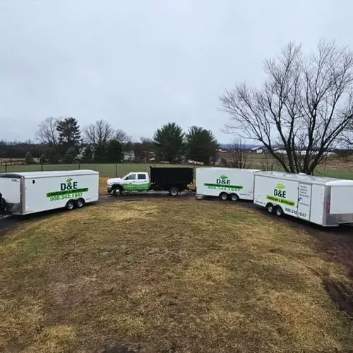 The D&E crew and trailers on a job site