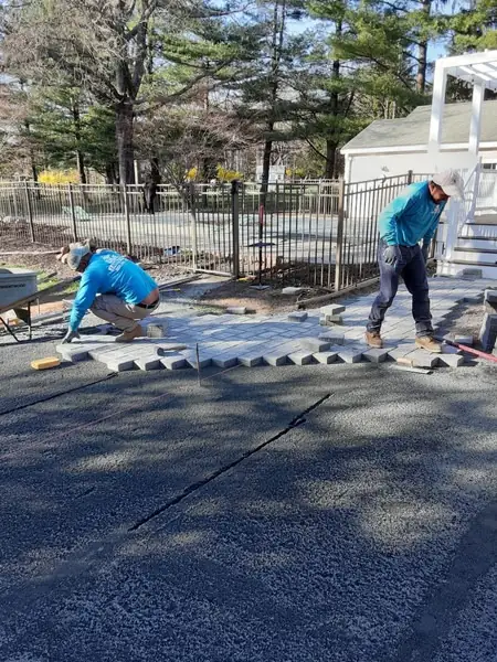 D&E crew laying pavers